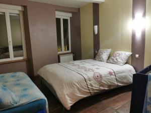 Postel nebo postele na pokoji v ubytování La petite maison de la Tante Marie