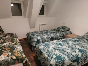 Postel nebo postele na pokoji v ubytování La petite maison de la Tante Marie