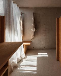 a room with a table and some towels on a wall at Terrestre, a Member of Design Hotels in Puerto Escondido