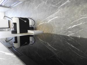 A kitchen or kitchenette at Morena Studio Apartment