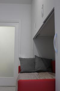 A bed or beds in a room at Morena Studio Apartment