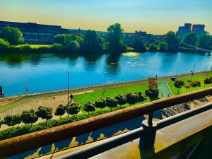 a view of a river from a bridge at Glasgow City Centre G1 PENTHOUSE with RiverViews - Duplex (4 Bedrooms, 3 Bathrooms, Kitchen, 1 Living room, 1 Dining room, 2 Terraces, Triple Garage 3 Parking spaces 'e-charging', Top Floor, 2050 sq ft, Merchant City) in Glasgow