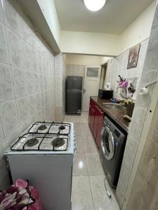 A kitchen or kitchenette at sporting sea view two bedroom appartement