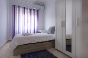 Ένα ή περισσότερα κρεβάτια σε δωμάτιο στο City apartment
