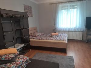 Posteľ alebo postele v izbe v ubytovaní DOM POD MARESZKĄ