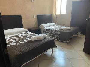 Een bed of bedden in een kamer bij Hotel San Salvador