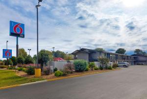 a building with a sign on the side of a road at Motel 6-Columbus, GA in Columbus +18 photos