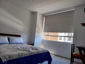 Postel nebo postele na pokoji v ubytování Hotel Prestigio JC