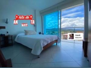 Hotel Manhattan Barbosa客房内的一张或多张床位