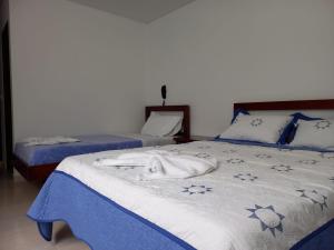 Postel nebo postele na pokoji v ubytování Hotel Prestigio JC