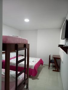 Postel nebo postele na pokoji v ubytování Hotel Prestigio JC