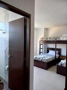 Postel nebo postele na pokoji v ubytování Hotel Prestigio JC