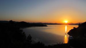 a sunset over a body of water at Apartment Ruza in Sobra