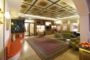 a living room with a couch and a rug at Bayerischer Hof in Freising