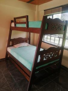 a bedroom with two bunk beds in a room at Finca Hotel - Piscina La Johanna in La Mesa