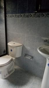 a bathroom with a toilet and a sink at Finca Hotel - Piscina La Johanna in La Mesa +33 photos