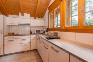 Kuchyň nebo kuchyňský kout v ubytování Apartment Honegg