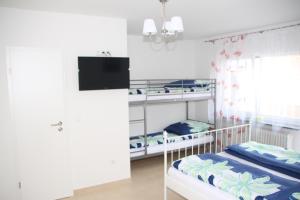 Postel nebo postele na pokoji v ubytování Pension Mimosa