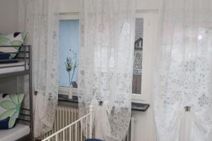 Postel nebo postele na pokoji v ubytování Pension Mimosa
