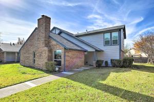 a brick house with a chimney on top of it at 17 Mi to Dallas Richardson Home with Hot Tub in Richardson