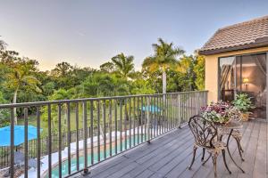 a deck with a table and chairs and a pool at Lavish Escape with Game Room - 20 Mi to Beach! in Palm Beach Gardens