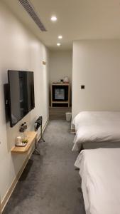 TV a/nebo společenská místnost v ubytování Michi Hotel - Luodong