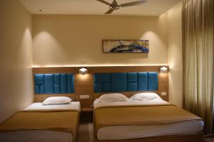 Postel nebo postele na pokoji v ubytování Hotel VPS Grand