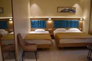 Postel nebo postele na pokoji v ubytování Hotel VPS Grand
