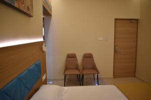 Postel nebo postele na pokoji v ubytování Hotel VPS Grand