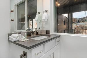a bathroom with a sink and a mirror at Quarry Springs Retreat in Park City +26 photos