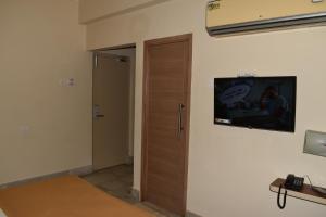 TV a/nebo společenská místnost v ubytování Hotel VPS Grand