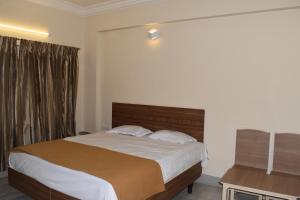 Postel nebo postele na pokoji v ubytování Hotel VPS Grand