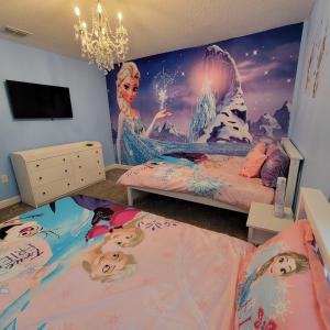 a bedroom with two beds and a mermaid mural at Winterfield at Disney 9350 in Kissimmee