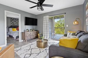 a living room with a couch and a bed at Lake Escape - Table Rock Lake in Branson