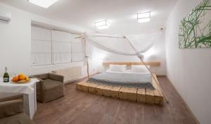 a bedroom with a bed with a mosquito net at Higina Spa Hotel in Truskavets +160 photos