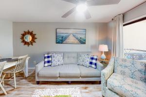 a living room with a couch and a table at Harbour Place 108 in Gulf Shores