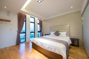 Postel nebo postele na pokoji v ubytování Han-Shian Boutique B&B
