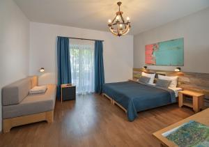 Giường trong phòng chung tại Butikhotel Visegrád