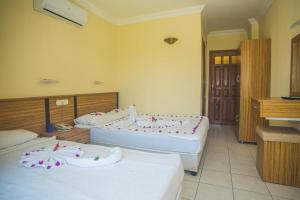 Postel nebo postele na pokoji v ubytování KEMER STAR HOTEL