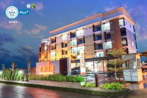 a building with a sign in front of it at Zada Residence in Nakhon Ratchasima