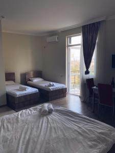 Postel nebo postele na pokoji v ubytování Hotel Horizont!