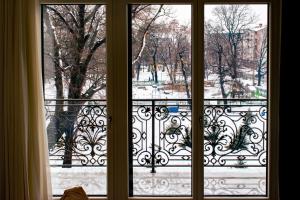 a window with a view of a park outside at HOTEL BALKAN in Bijeljina