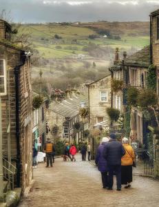 a group of people walking down a street at Bronte Bungalow - In Beautiful Bronte Country! in Oxenhope