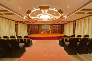 a large room with chairs and a stage in it at ICON Express by BHAGINI Hoodi in Bengaluru
