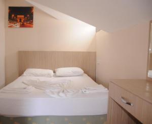 Postel nebo postele na pokoji v ubytování KEMER STAR HOTEL