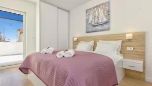 Postel nebo postele na pokoji v ubytování villa GOLDEN ROSE
