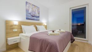 Postel nebo postele na pokoji v ubytování villa GOLDEN ROSE