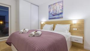 Postel nebo postele na pokoji v ubytování villa GOLDEN ROSE