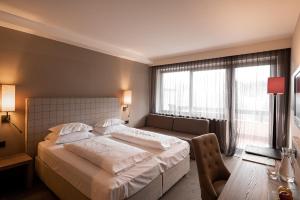 Postel nebo postele na pokoji v ubytování Hotel Pollinger
