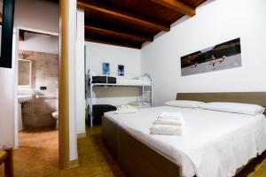 מיטה או מיטות בחדר ב-B&B Macchia Mediterranea